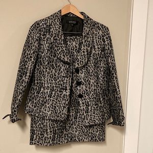 Used and in excellent condition size 10 two piece black and silver skirt set!